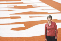 Chris Plonsky pictured in the end zone of the Darrell K Royal-Texas Memorial Stadium Field (Credit: Kelly West, Houston Chronicle).